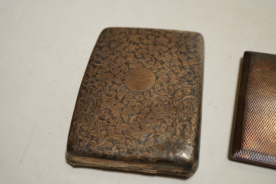 Two George V silver cigarette case, one foliate engraved Birmingham, 1912 the other folaite engraved Birmingham, 1919 Willaim Neale Ltd and a George VI engine turned cigarette case, weight approx. 14.43ozt (3)